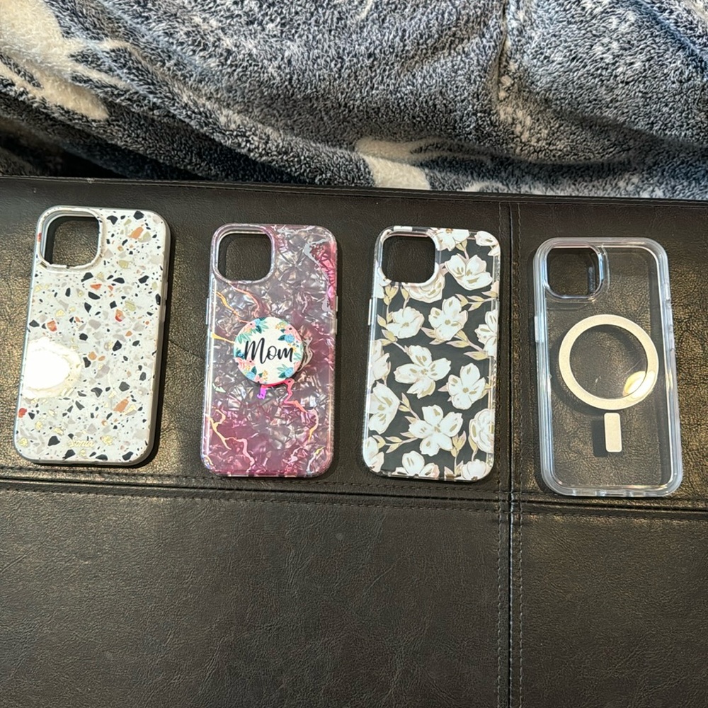 I phone 14 cases & 4 extras 2 extra ear bud covers 1 I watch band 1 kickstick